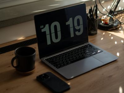 Minimalist desk setup with digital clock and lamp
