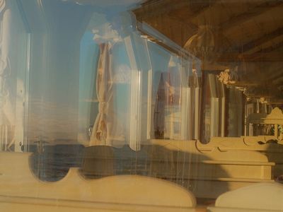 Sunlight filtering through abstract geometric window patterns